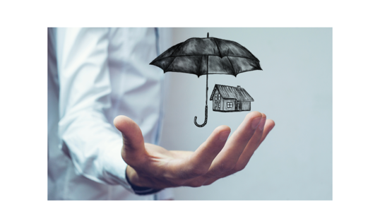 Hand under umbrella and house